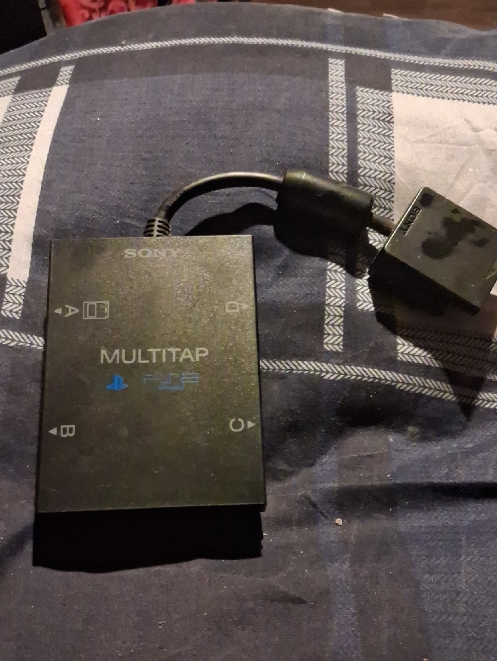 Sony Multitap Accessory in Black with Blue Logo